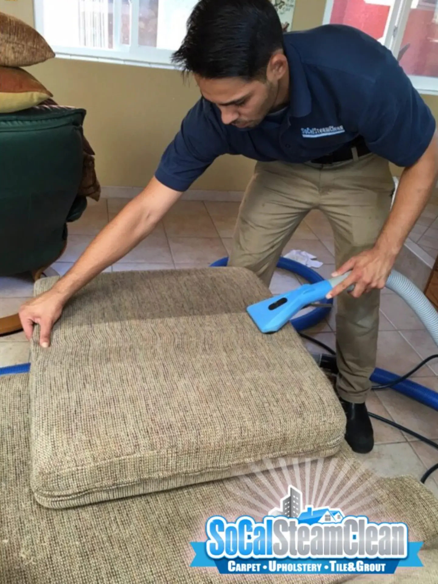 Upholstery cushion being cleaned