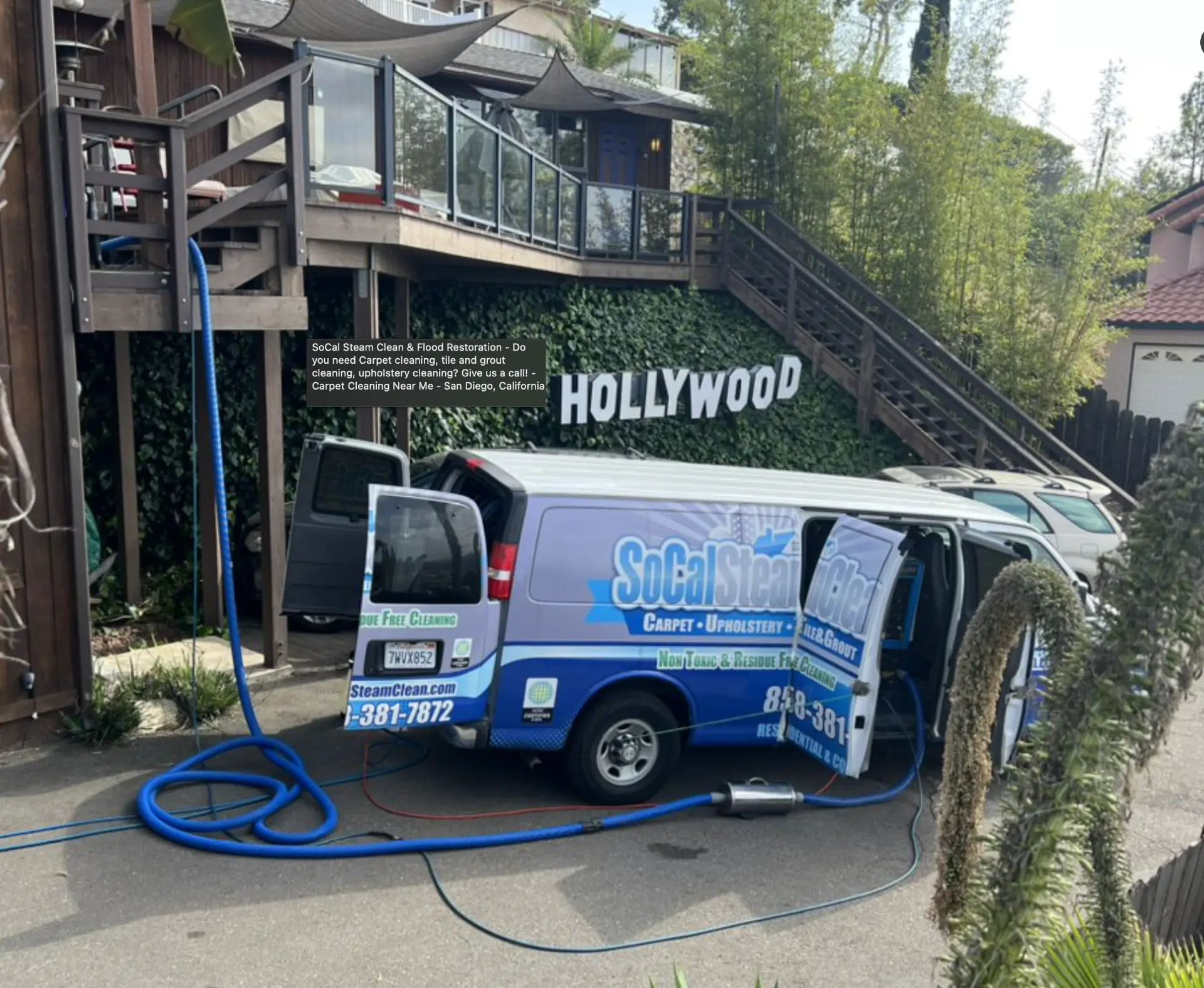 On the job in San Diego — SoCal Steam Clean SoCal Steam Clean van parked on a San Diego driveway with hoses run into a hillside home for carpet cleaning
